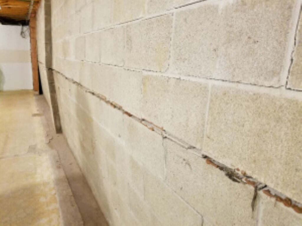 basement wall repair warning signs